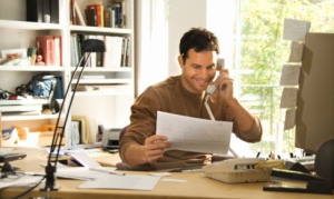 man-on-phone-in-home-office